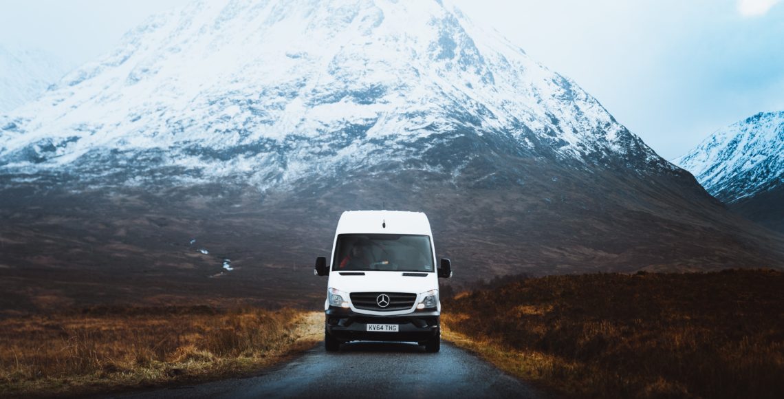 mercedes camper van in front of mountains