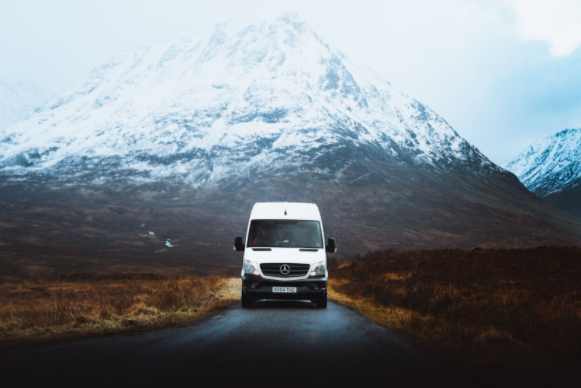 Mercedes van with a mountain behind