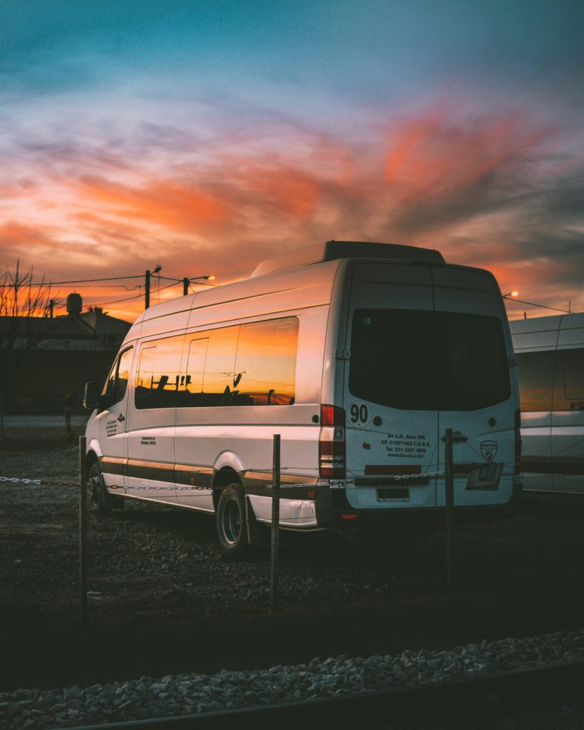 White van with a sunset behind